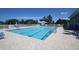 Inviting community pool with ample deck space and lounge chairs at 1256 Spoonbill Landings Cir, Bradenton, FL 34209