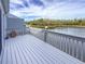 White wooden deck overlooking a tranquil waterway at 1256 Spoonbill Landings Cir, Bradenton, FL 34209