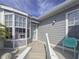 Inviting front entry with bay window and teal chair at 1256 Spoonbill Landings Cir, Bradenton, FL 34209