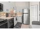 Updated kitchen with stainless steel appliances and tile backsplash at 1256 Spoonbill Landings Cir, Bradenton, FL 34209