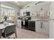 Modern kitchen with stainless steel appliances and breakfast nook at 1256 Spoonbill Landings Cir, Bradenton, FL 34209