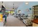 Bright living room with comfy seating and access to a balcony at 1256 Spoonbill Landings Cir, Bradenton, FL 34209