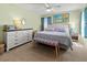 Spacious main bedroom with a king-size bed and dresser at 1256 Spoonbill Landings Cir, Bradenton, FL 34209