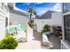 Charming patio with seating area and landscaping at 1256 Spoonbill Landings Cir, Bradenton, FL 34209