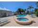 Community pool and spa with lounge chairs at 1256 Spoonbill Landings Cir, Bradenton, FL 34209