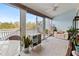 Relaxing sunroom with comfortable seating and water views at 1256 Spoonbill Landings Cir, Bradenton, FL 34209