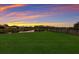 Large backyard with a grassy area and a fence at 13627 American Prairie Pl, Lakewood Ranch, FL 34211