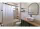 Modern bathroom with a wood vanity, vessel sink, and tile shower at 13627 American Prairie Pl, Lakewood Ranch, FL 34211
