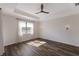 Bright bedroom with wood floors and large window at 13627 American Prairie Pl, Lakewood Ranch, FL 34211