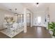 Modern dining room with white chairs and a glass table at 13627 American Prairie Pl, Lakewood Ranch, FL 34211