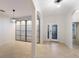 Entryway with tiled floors, storage, and view to living room at 13627 American Prairie Pl, Lakewood Ranch, FL 34211