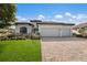 Beautiful two-car garage home with manicured lawn and paver driveway at 13627 American Prairie Pl, Lakewood Ranch, FL 34211