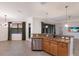 Island kitchen with stainless steel appliances and granite countertops at 13627 American Prairie Pl, Lakewood Ranch, FL 34211