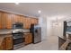 Well-equipped kitchen, featuring stainless steel appliances and granite countertops at 13627 American Prairie Pl, Lakewood Ranch, FL 34211