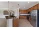 Modern kitchen with stainless steel appliances and granite countertops at 13627 American Prairie Pl, Lakewood Ranch, FL 34211