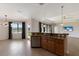 Open concept kitchen with island and stainless steel appliances at 13627 American Prairie Pl, Lakewood Ranch, FL 34211