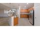 Modern kitchen featuring wood cabinets and granite countertops at 13627 American Prairie Pl, Lakewood Ranch, FL 34211