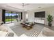 Spacious living room with sliding glass doors leading to the backyard at 13627 American Prairie Pl, Lakewood Ranch, FL 34211