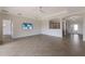 Open concept living area with views to kitchen and entryway at 13627 American Prairie Pl, Lakewood Ranch, FL 34211