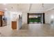 Spacious living room with sliding glass doors and sunset view at 13627 American Prairie Pl, Lakewood Ranch, FL 34211