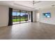 Open living area featuring tile flooring and a view of the backyard at 13627 American Prairie Pl, Lakewood Ranch, FL 34211