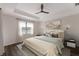 Relaxing main bedroom with wood floors and stylish decor at 13627 American Prairie Pl, Lakewood Ranch, FL 34211