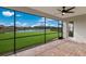 Relaxing screened patio overlooking a pond and homes at 13627 American Prairie Pl, Lakewood Ranch, FL 34211