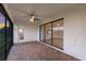 Covered patio with glass sliding doors and view of backyard at 13627 American Prairie Pl, Lakewood Ranch, FL 34211