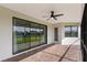 Spacious screened patio with pavers and pond view at 13627 American Prairie Pl, Lakewood Ranch, FL 34211