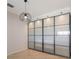 Well-lit storage room with modern sliding glass doors at 13627 American Prairie Pl, Lakewood Ranch, FL 34211