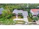 Single story home with a large driveway and mature landscaping at 1616 North Dr, Sarasota, FL 34239