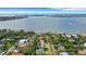 Aerial view of a house nestled in a quiet neighborhood, near the water at 1616 North Dr, Sarasota, FL 34239