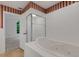 Bathroom with a large tub and separate shower at 1616 North Dr, Sarasota, FL 34239