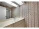 Clean bathroom with sink, vanity, and floral wallpaper at 1616 North Dr, Sarasota, FL 34239
