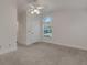 Bedroom with grey carpeting and a ceiling fan at 1616 North Dr, Sarasota, FL 34239