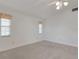 Spacious bedroom with two windows and ceiling fan at 1616 North Dr, Sarasota, FL 34239
