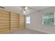 Bedroom with built-in shelving and window at 1616 North Dr, Sarasota, FL 34239