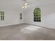 Large bedroom with plush carpeting and a ceiling fan at 1616 North Dr, Sarasota, FL 34239