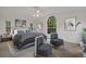 Main bedroom with a king-size bed and two accent chairs at 1616 North Dr, Sarasota, FL 34239