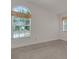 Bedroom with large window and neutral decor at 1616 North Dr, Sarasota, FL 34239
