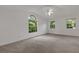 Bright bedroom featuring a large window and ceiling fan at 1616 North Dr, Sarasota, FL 34239
