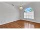 Dining room with hardwood floors, an arched window, and a chandelier at 1616 North Dr, Sarasota, FL 34239