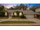 Brick ranch home with a two-car garage and well manicured lawn at 1616 North Dr, Sarasota, FL 34239