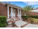 Brick home with a front porch and landscaping at 1616 North Dr, Sarasota, FL 34239