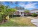 Brick house with landscaping and a paved driveway at 1616 North Dr, Sarasota, FL 34239