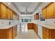 Kitchen with wood cabinets, tile flooring, and a breakfast nook at 1616 North Dr, Sarasota, FL 34239