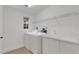 Laundry room with washer, dryer, and window at 1616 North Dr, Sarasota, FL 34239