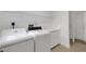 Laundry room with washer, dryer, and cabinets at 1616 North Dr, Sarasota, FL 34239