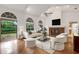 Spacious living room with hardwood floors, vaulted ceiling, fireplace and access to backyard at 1616 North Dr, Sarasota, FL 34239