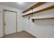 Clean storage room with shelving and exterior access at 1616 North Dr, Sarasota, FL 34239